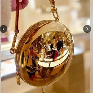 Louis Vuitton Gold Metallic Round Mini Wristlet